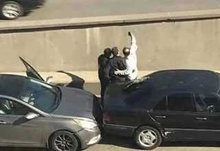 two guys taking a selfie after getting into a car crash -  woman posing on a cross