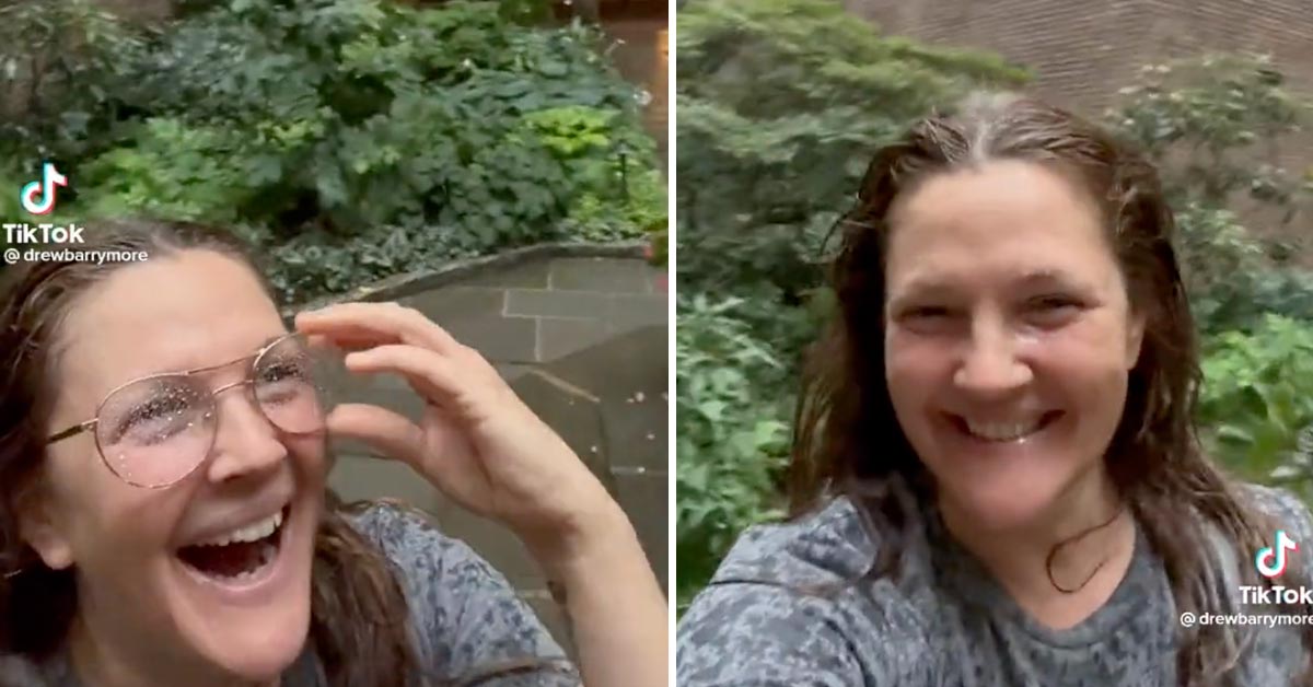 Drew Barrymore smiling in the rain