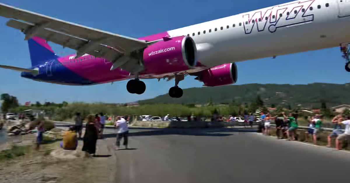 airplane makes incredibly low landing at beach airport in greece