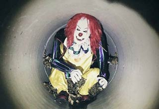 a creepy clown in a tunnel