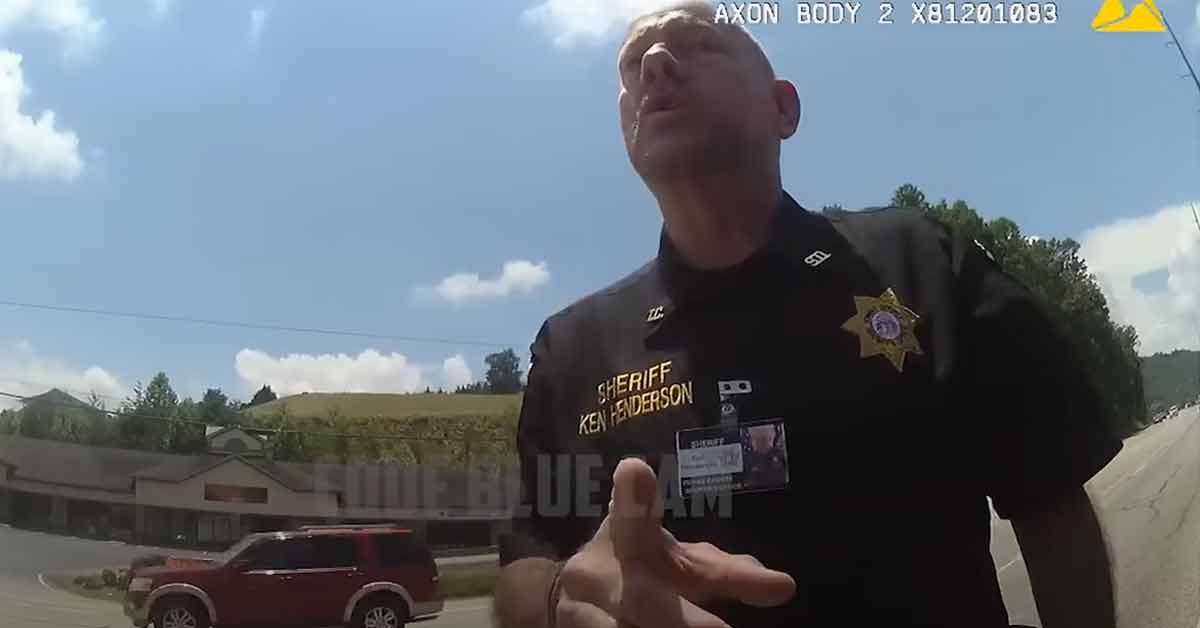a sheriff yelling at a city cop