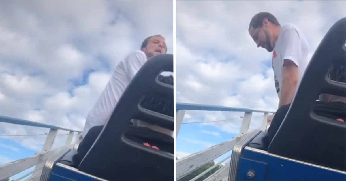dude tries to climb out of Six Flags roller coaster when it gets stuck on the tracks