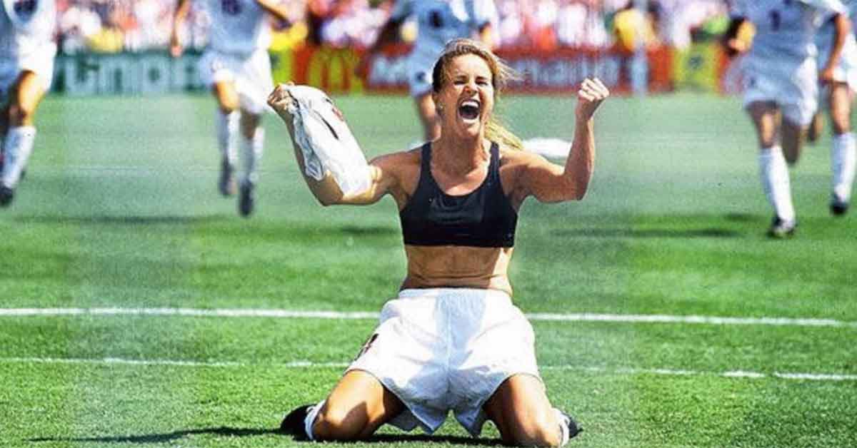 Brandy Chastain celebrating with her shirt off