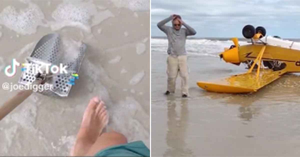 man standing next to hiss crashed plane on the beach