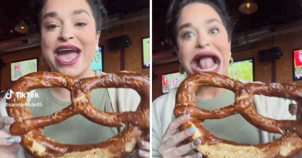woman with the world's largest mouth tries to eat a massive pretzel