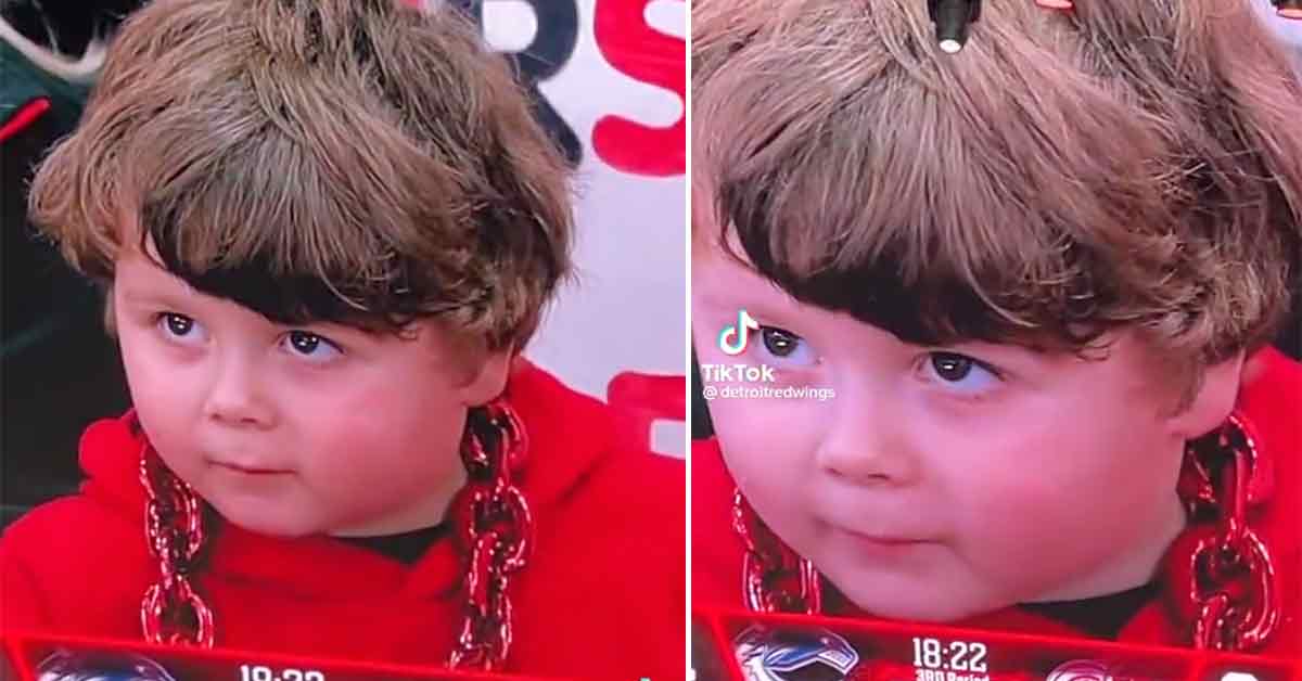 cute kid steals the show at a hockey game when he's shown on the jumbotron