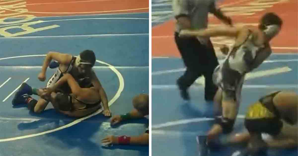 wrestler punches opponent during match