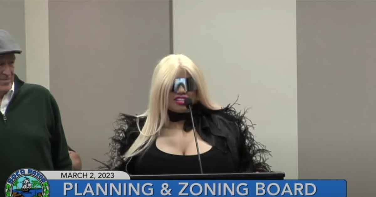 woman with blonde hair and glasses speaks at a planning and zoning board meeting in Boca Raton