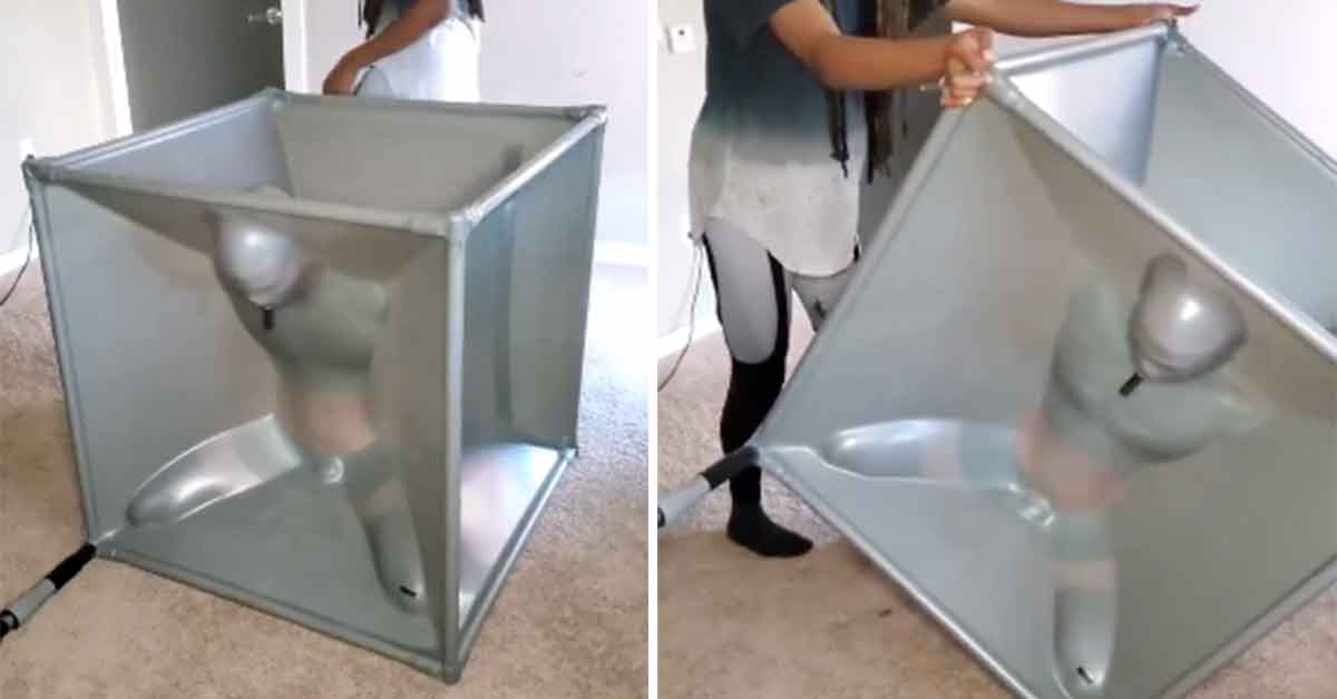 Man in Latex Vacuum Sealed Cube Takes Kink to a Whole New Level