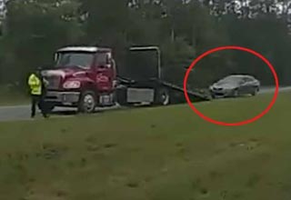 Car Launches off Tow Truck Ramp Due To a Distracted Driver