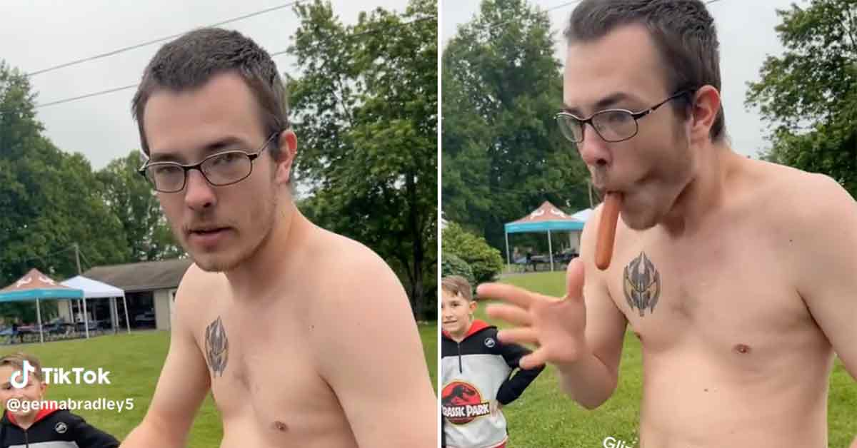 shirtless dude sucking down hot dogs