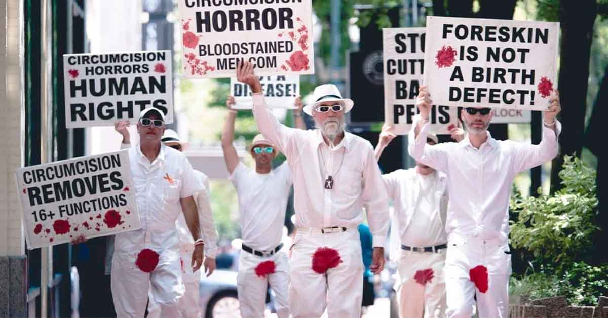 anti-circumcision protestors walking down the street