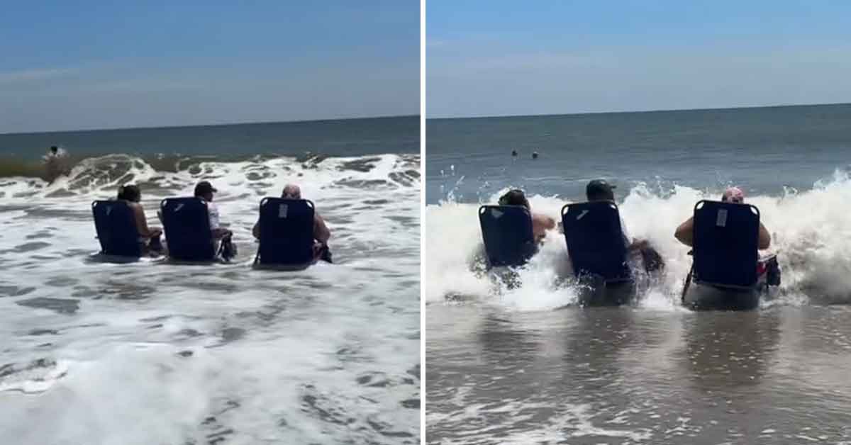 Beach Goers Compete in a Game of “Last one Sitting” During Rising Tide