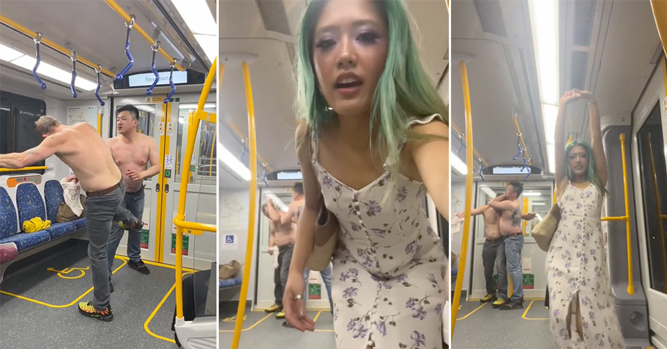 Influencer Poses For Camera As Two Shirtless Middle Aged Men Wrestle On Train