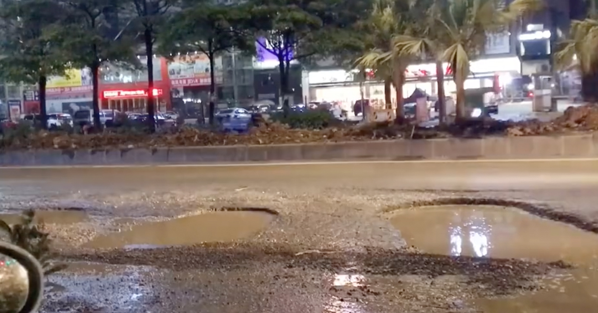 Watch Car After Car Bottom Out On the World's Worst Pothole