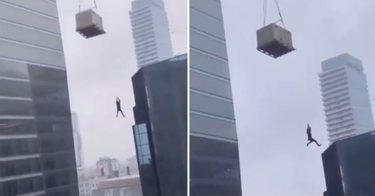 Construction Worker Hangs From Pallet 30 Floors In the Air