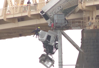 Driver Rescued From Semi-Truck Dangling Off Bridge