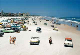 <p>Daytona Beach has been a popular vacation destination for over a century, attracting spring breakers, NASCAR fans, and water-front tailgaters.&nbsp;</p><p><br></p><p>Check out these awesome photos showcasing the hot beach's evolution over the last 120 years.&nbsp;</p>