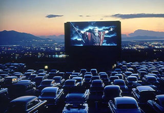 <p>Long before Nicole Kidman served as the spokeswoman of AMC, doing her Oscar-winning best to convince us streaming-hardened film buffs that heartbreak can feel good in a place that costs $30.00 to enter, the moviegoing experience was a whole lot different in the early days of film. Enter drive-in movies. With tiered parking and piped-in audio, drive-in theaters were staples of the early 1900s, bringing all the magic of cinema to the comfort of your car.&nbsp;</p><p><br></p><p>From cuddling couples to a concession stand that comes to you, here are 21 photos of old-school drive-in movies.</p>