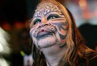 <p>Getting a tattoo is one thing, but turning your face into an alien-looking cat is something else.&nbsp;</p><p><br></p><p>Still, adults have the right to do whatever they want to their bodies, even if the rest of us think it's absolute insanity and can't bear to look at it except out of morbid curiosity.&nbsp;</p><p><br></p><p>The body modification community has a tendency to take things too far, and I'd bet that's exactly what most people would argue these 22 body artists have done.&nbsp;</p>