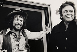 <p>Long before Luke Combs, Miranda Lambert, and Morgan Wallen emerged as the modern faces of country music, the genre was a whole lot more rugged. Enter legendary artists like Johnny Cash, Willie Nelson, Merle Haggard, and Kris Kristofferson, legends who put grit and soul into the music that defined middle-America.&nbsp;</p><p><br></p><p>From smoke-fueled studio sessions to performances at the Grand Ole Opry, here are 33 Nostalgic pics of your favorite outlaw country stars.&nbsp;</p>