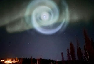 <p>A bright red hole in our upper atmosphere. Rainbow clouds. A giant spiral illuminating the Alaskan night. No, these aren't proposed additions to the next <em>Elden Ring</em> installment, but rather real phenomena spotted in our own sky ... and caught on camera.&nbsp;</p><p><br></p><p>From an electric "dirty thunderstorm" creeping up on a volcano to the planets quite literally aligning, here are 21 awe-inspiring space and nature pics for your ocular enjoyment.&nbsp;</p>