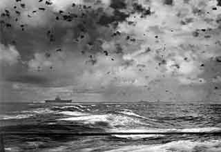 <p>While World War II was wrapping up in Europe, millions of troops were forced to continue fighting the war's most intense battles at sea, thousands of miles from home.&nbsp;</p><p><br></p><p>The Pacific Theater saw imperial Japan throw their entire might at the Allied Navy, including kamikaze dive bombers, while refusing to surrender until the bitter end. The battles were chaotic, as aircraft carriers from both sides threw thousands of planes at one another, often ending in brutal stalemates or costly victories.&nbsp;</p><p><br></p><p>It's impossible to know what life must have been like on those ships, but what images we have paint a dire picture. Here are 25 dramatic photos of the Pacific Theater's chaos.&nbsp;</p>