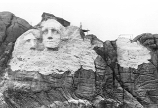 <p>Since its authorization in 1925, Mount Rushmore has always been controversial.&nbsp;</p><p><br></p><p>Depicting detailed portraits of four American Presidents &mdash; George Washington, Thomas Jefferson, Theodore Roosevelt, and Abraham Lincoln &mdash; the monument garners upwards of 2 million visitors each year and brings <a href="https://www.nps.gov/moru/learn/news/tourism-to-mount-rushmore-national-memorial-contributes-385-6-million-to-local-economy.htm" rel="noopener noreferrer" target="_blank">in roughly $385.6 million</a> to South Dakota&#39;s economy in 2022 alone, but still serves as a long-standing wound to several Plains Indians &mdash; including the Lakota Sioux &mdash; a near-century later.&nbsp;</p><p><br></p><p>Alongside the featured <a href="https://www.amnh.org/exhibitions/addressing-the-statue/timeline" rel="noopener noreferrer" target="_blank">Presidents&#39;</a>
<a href="https://www.washingtonpost.com/history/2019/08/25/george-washington-owned-slaves-ordered-indians-killed-will-mural-that-history-be-hidden/" rel="noopener noreferrer" target="_blank">notably</a>
<a href="https://lawandinequality.org/2021/11/23/thomas-jefferson-derailing-the-native-american-future-2/" rel="noopener noreferrer" target="_blank">anti-Indigenous</a>
<a href="https://www.history.com/news/abraham-lincoln-native-americans" rel="noopener noreferrer" target="_blank">views</a>, the work&#39;s location on stolen land adds insult to injury, per <a href="https://www.pbs.org/wgbh/americanexperience/features/rushmore-sioux/" rel="noopener noreferrer" target="_blank"><em>PBS</em></a>. Mount Rushmore is etched into the &quot;Six Grandfathers&quot; mountain in the Black Hills, both of which are not only considered sacred to several local tribes but were on illegally seized lands taken in the 1870s.&nbsp;</p><p><br></p><p>But even with this painful veil of controversy, one thing is certain: The photos of its construction are truly a harrowing sight to behold. From early models of the mountain to dangling workers, here is the construction of Mount Rushmore, as told in 24 photos.&nbsp;</p>