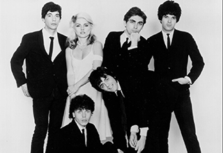 <p>Throughout the '70s and '80s, Blondie was a force to be reckoned with. Led by too-cool frontwoman Debbie Harry, the group topped the charts — and helped define pop culture – &nbsp;making them one of the most iconic new wave bands in all of music history.&nbsp;</p><p><br></p><p>From their inception to their lasting legacy, here are 15 photos telling the story of Blondie, the coolest new wave band ever.&nbsp;</p>