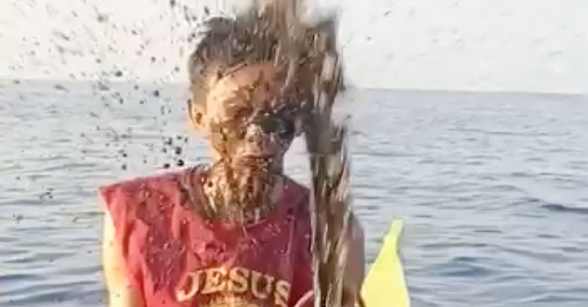 Fisherman Showing Off Massive Squid Gets Face Full of Ink