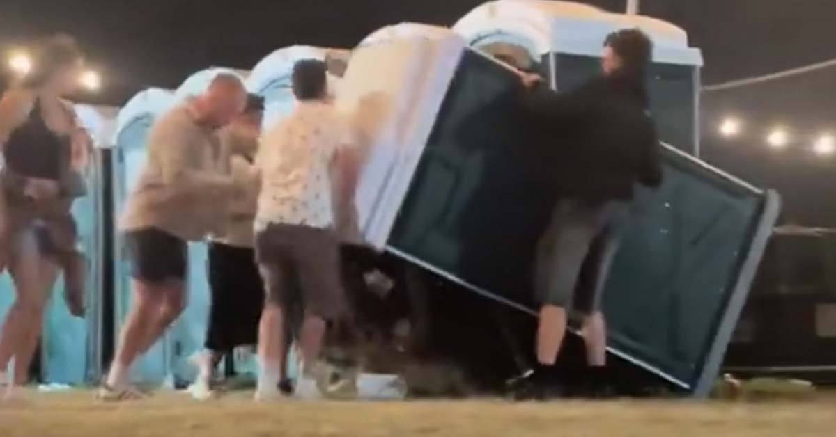 Festivalgoers ‘Prank’ Dude By Tipping Over Porta-Potty While He’s Inside