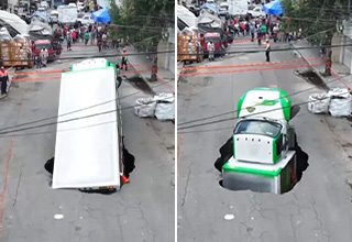 A Soda Truck Fell Through a Sinkhole in the Middle of the Street