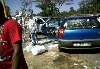 The people in the blue car had a 5 gallon bucket of paint on the back seat when they had the accident.