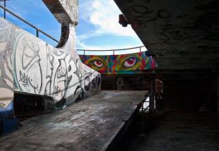 Miami Marine Stadium was built in 1962, shuttered in 1992 and artists are trying to help save it by painting murals.  The entire structure is covered in graffiti and it sits right on Biscayne Bay.