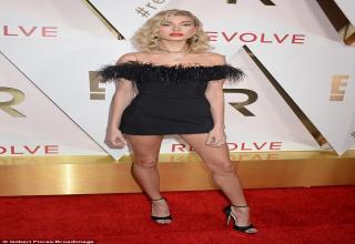Hailey Baldwin was a scene-stealer at The Dream Hotel in Hollywood on Thursday when she attended the #REVOLVE Awards.
The 20-year-old model, scion of the Baldwin acting family, showed off her sculpted legs in a tiny black off-the-shoulder cocktail dress.
Black fringe ringed her neckline, and she balanced on a sky-high pair of black ankle-strap st