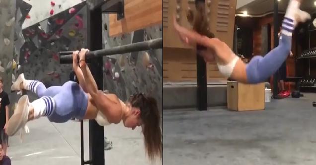 sexy girl gets it done at climbing gym