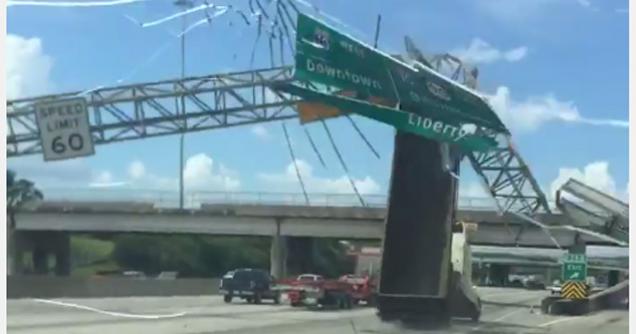 Dump Truck Takes Out Freeway Sign Going Full Speed