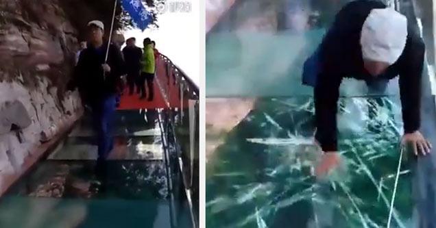 man walking on glass bridge that plays cracking animation