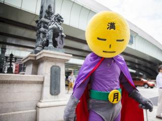 Anonymous Man In A Superhero Costume Is Fighting Grime In Tokyo