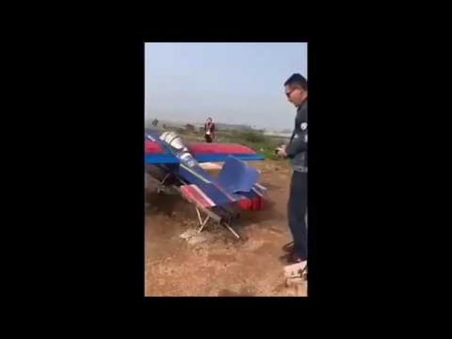 Man uses a model plane to take a chicken parachuting