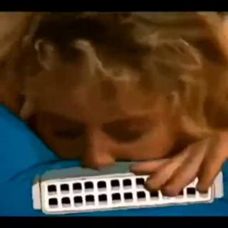 This girl can play the harmonica.