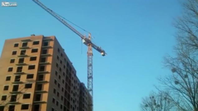 Guy attempts walking a crane and falls off