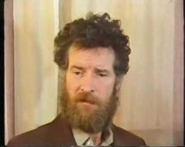 A doctor interviews a man with wet brain from chronic alcohol abuse