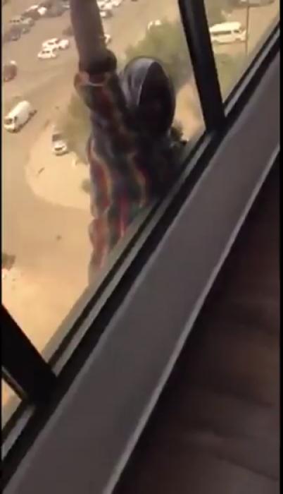 Maid falls several stories as boss records.