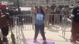 Black Girl standing on US Flag. US Servicemen Turn Their Back, Literally!
