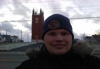 First Snowfall has Fallen in Eastern Cape Breton Island and it is in Sydney Nova Scotia and it is very Cold outside in Sydney today and freezing outside too while Frankie MacDonald Wears a Winter Hat and Gloves on a Day like that Today.