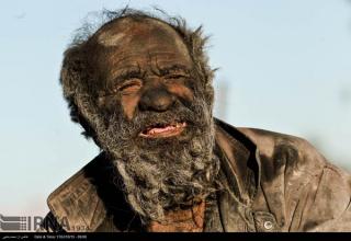 The 80-year-old Amoo Hadji who lives in the village of Dezhgah city of Farashband in Fars province of Iran, has not showered for almost 60 years. Amoo Hadji lives the most primitive life. His most valuable possession seems to be a three-inch steel pipe which he uses to smoke animal dung with.