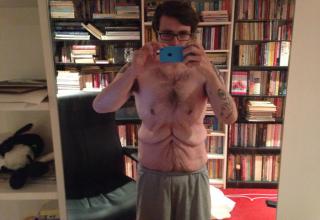 Astronomer John Burton displays his shirtless body so that the world can see what his transformation really looked like.