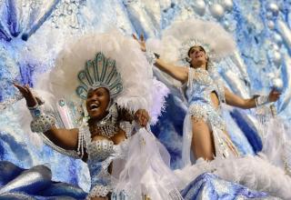 People perform during the first night of carnival parade at the Anhembi Sambadrome in Sao Paulo, Brazil.