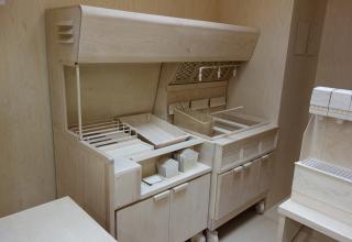 Roxy Paine built a full scale replica of a fast food kitchen out of birch and maple wood entitled "Carcass"...